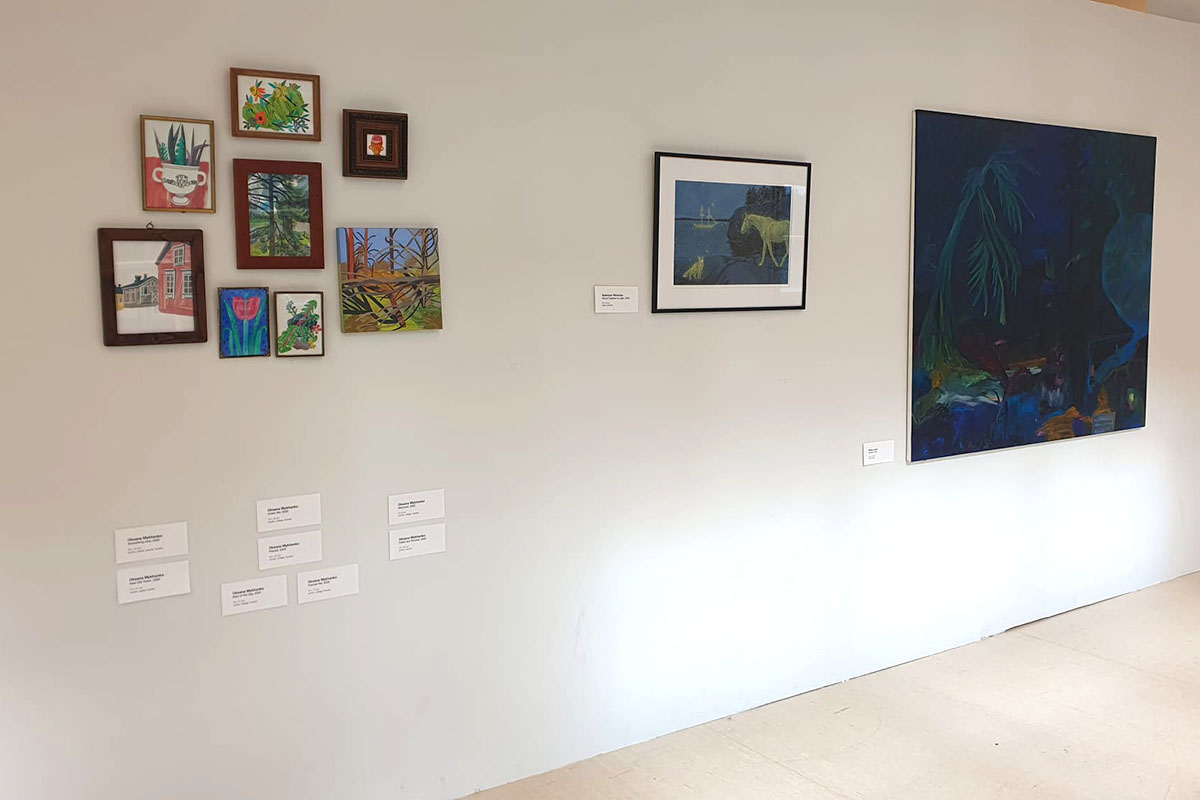 A white gallery wall displays artworks by Oksana Mykhanko, Katya Yehorova and Renja Leino