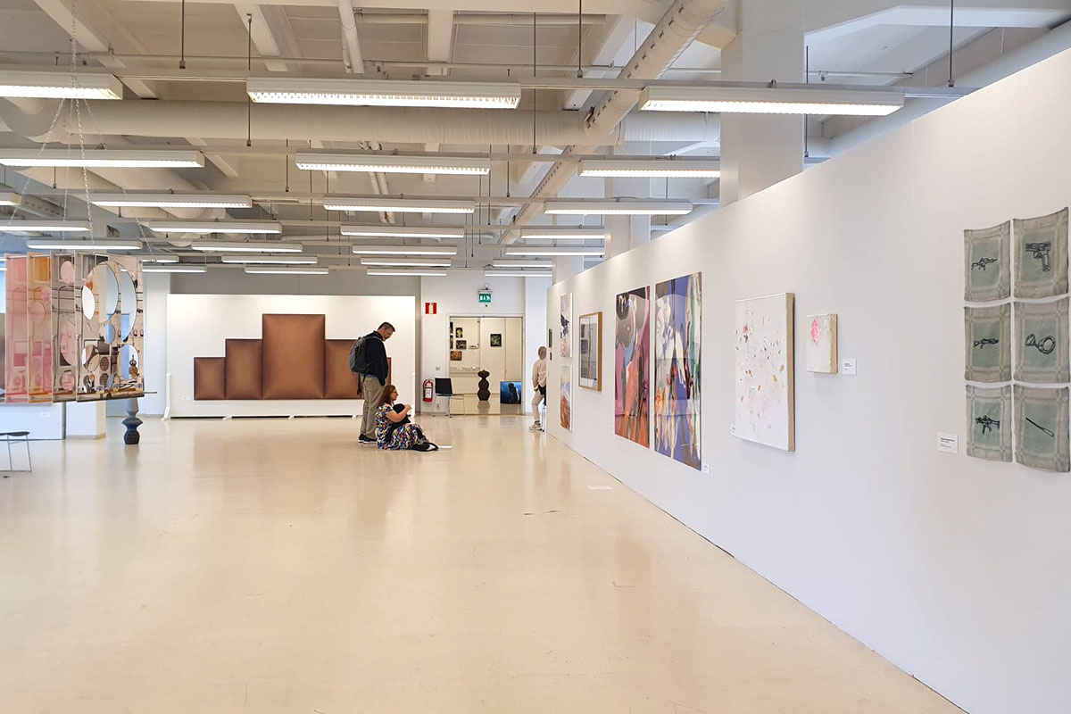 A white gallery wall displays artworks by Oksana Mykhanko, Katya Yehorova and Renja Leino